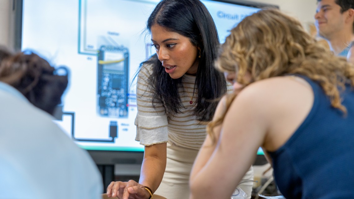 Sruti Yanamandra ’22, a master’s student in mechanical engineering, introduces Internet of Things technology to students at Geneva High School.