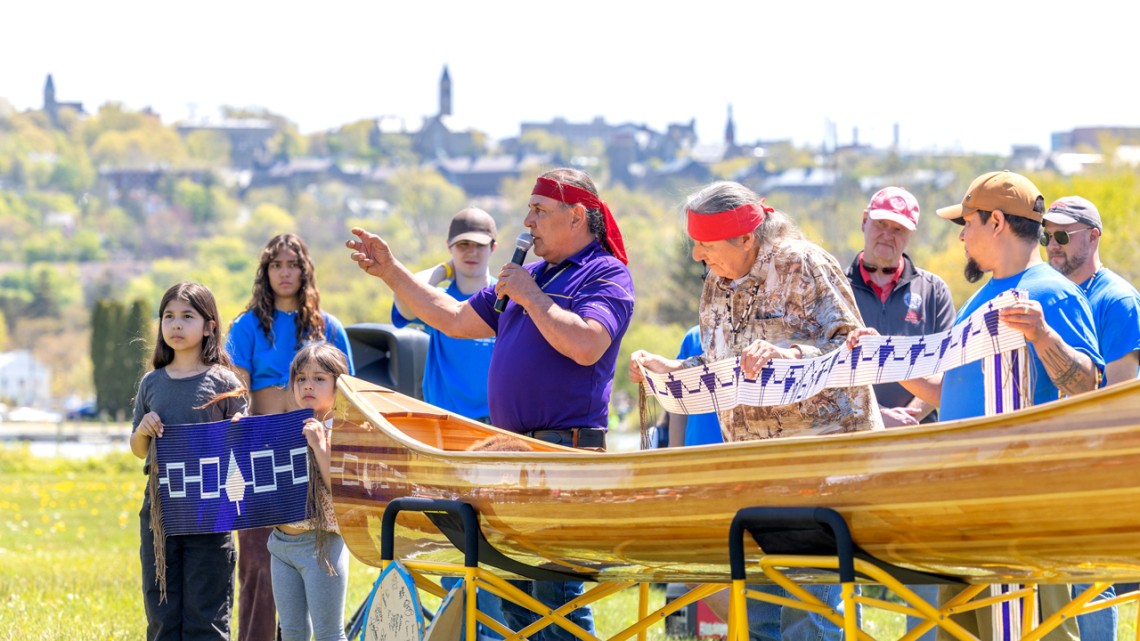 Jake Edwards gives introductory remarks during the canoe dedication ceremony at Cass Park.