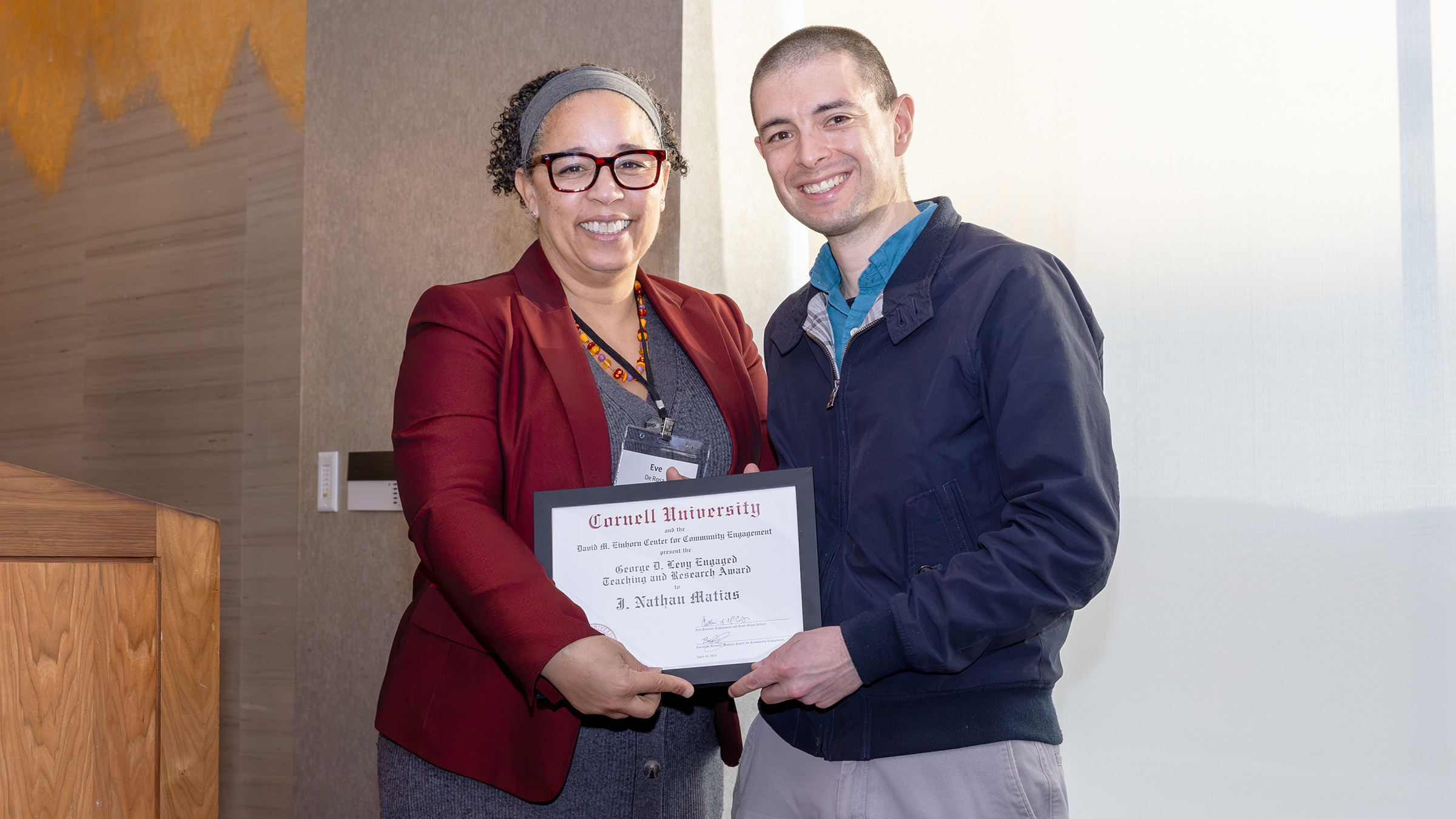 Matias (right) receives the Levy Award from Eve De Rosa, dean of faculty and the Mibs Martin Follett Professor in Human Ecology, at the Einhorn Center’s 2nd Annual Community Engagement Awards.