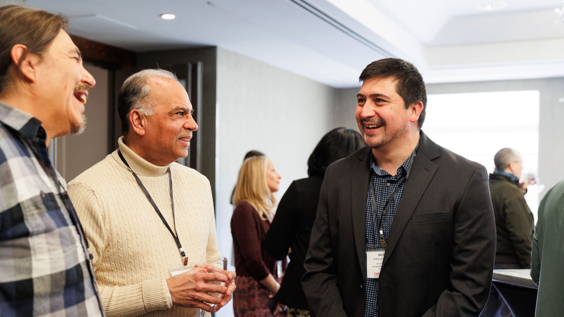 Stephen Henhawk, Karim-Aly Kassam and Michael Charles at the reception before the third annual community-engaged awards event on April 8 in the Statler Ballroom.
