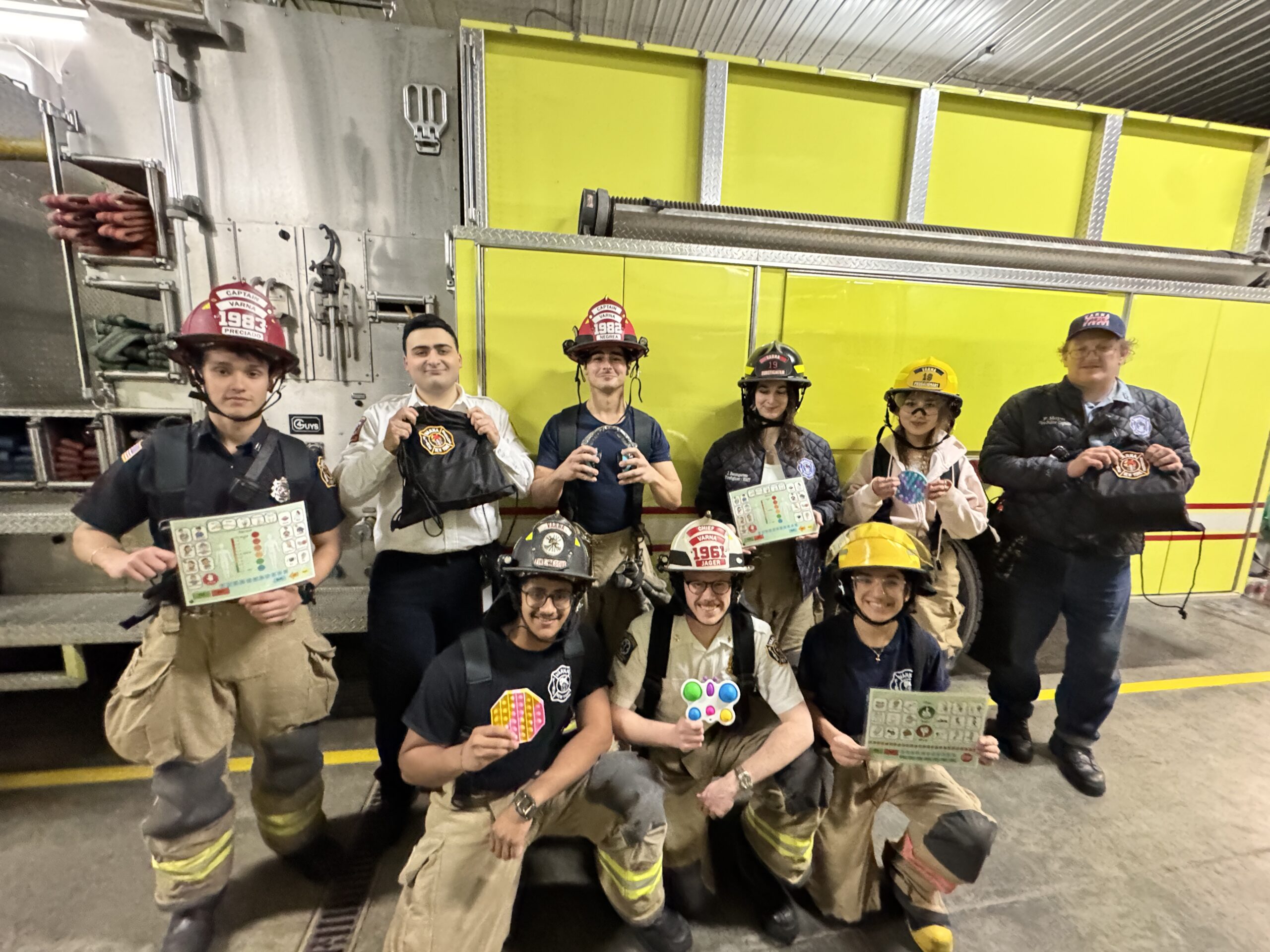 Varna Volunteer Fire Company members show the new sensory kits developed in partnership with Michelle Tcherevatenko ’25. Provided.
