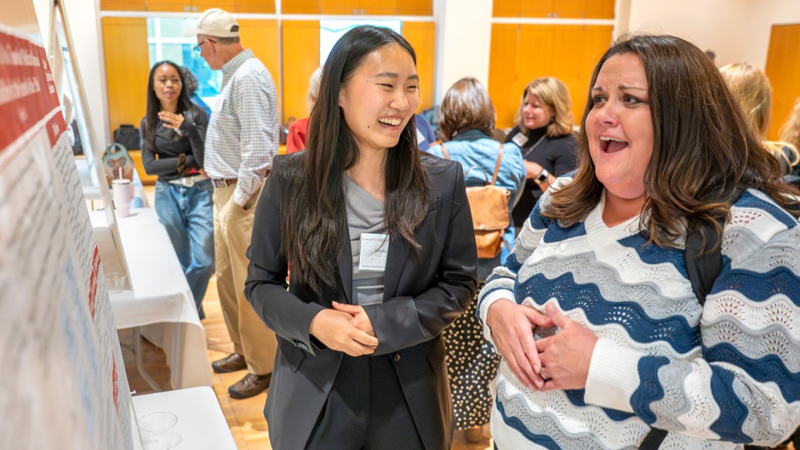 Cornell Cooperative Extension Summer Intern Sophia Li May '28 (left) describes her summer project “Using AI to Translate Medical Outcomes and their Probabilities for the Benefit of the Public” to CCE Monroe County Board President Melissa Brown during the Sept. 9 CCE Summer Internship Reception in the Biotechnology Building. R.J. Anderson/Cornell University