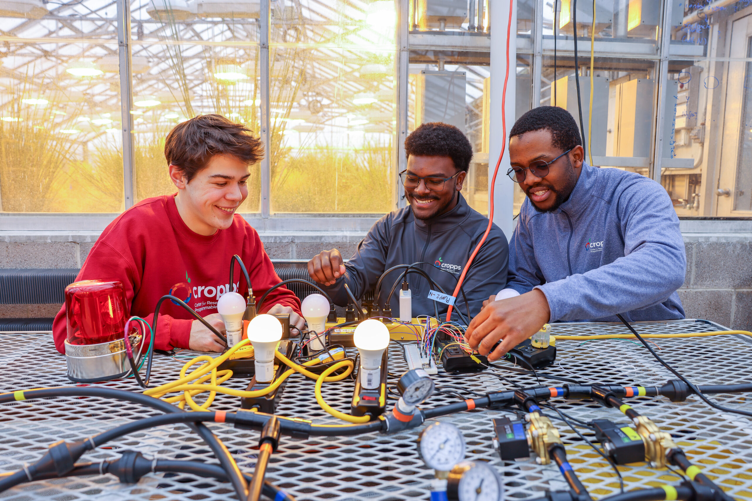 CROPPS-in-a-Box students Bobby Henkelmann ’28, Daneil Baldeo-Thorne ’25 and Muna Nwaiwu Ph.D. ’32. photo/Henry Smith and Savan DeSouza.