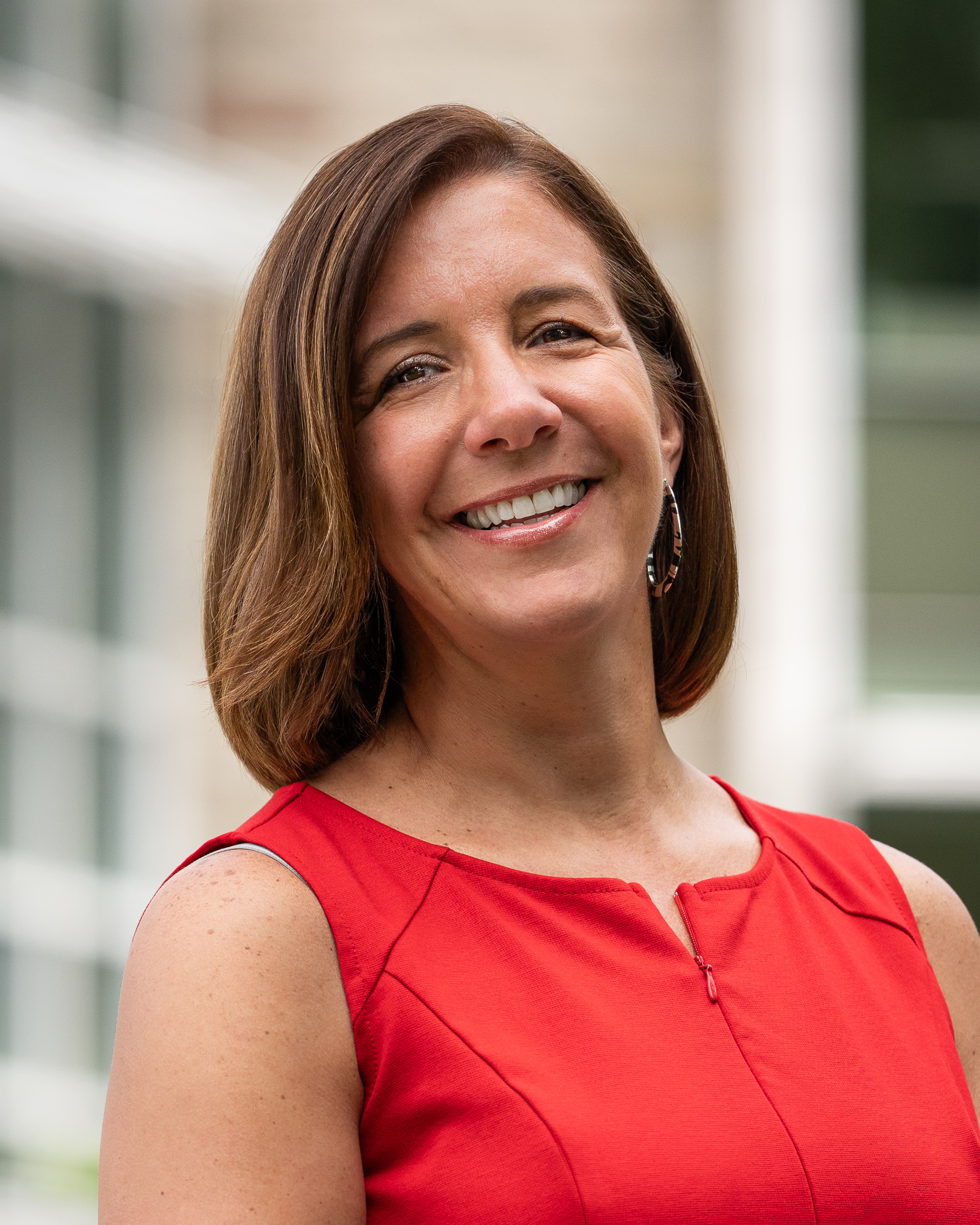 Portrait of Julie Edwards in front of the Cornell Health building.