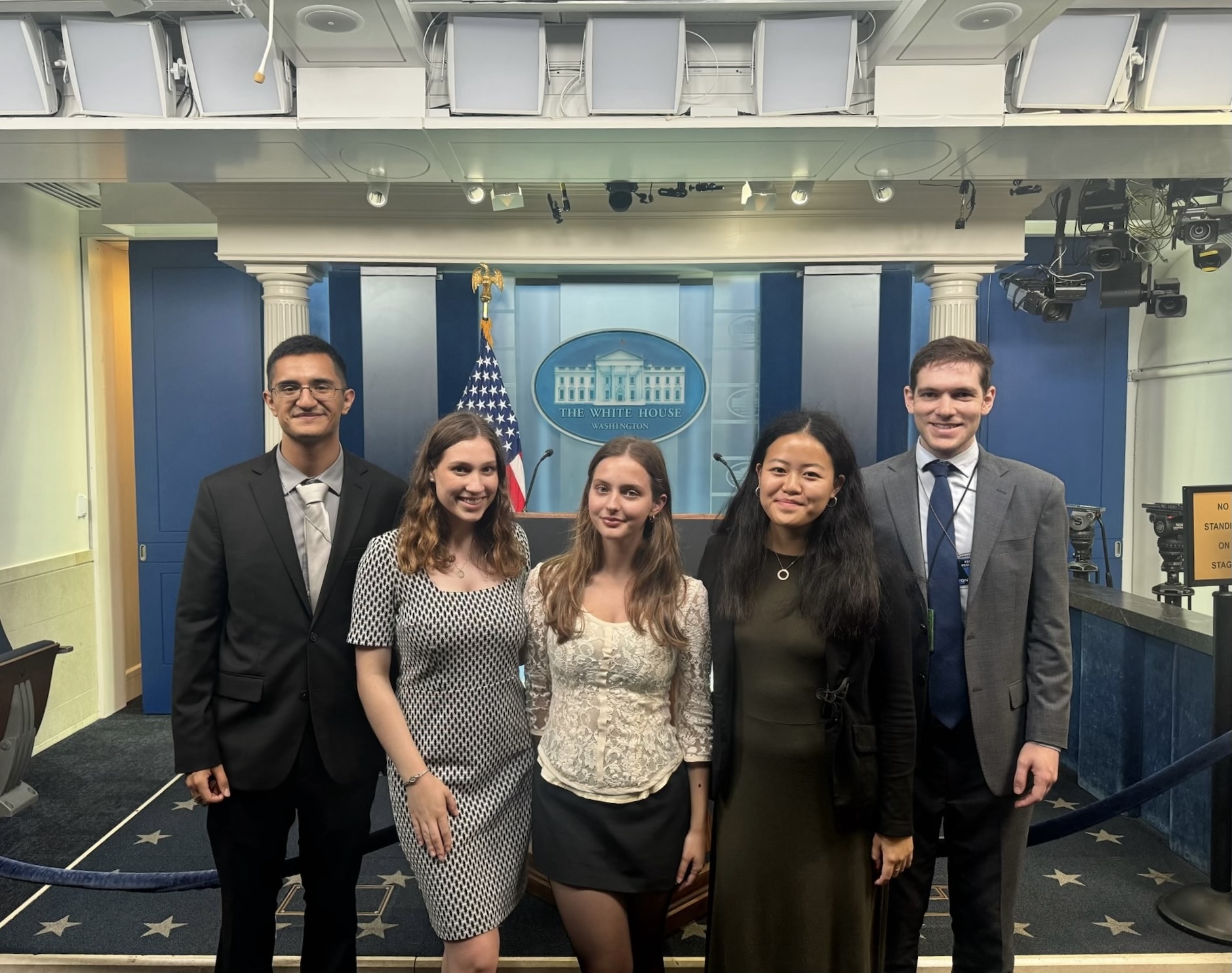 Interns Miguel Valdovinos, Cate Miller, awardee Ariela Asllani ’26, Emma Chen and Zach Slotkin in the James S. Brady Press Briefing Room in the White House West Wing. photo/provided
