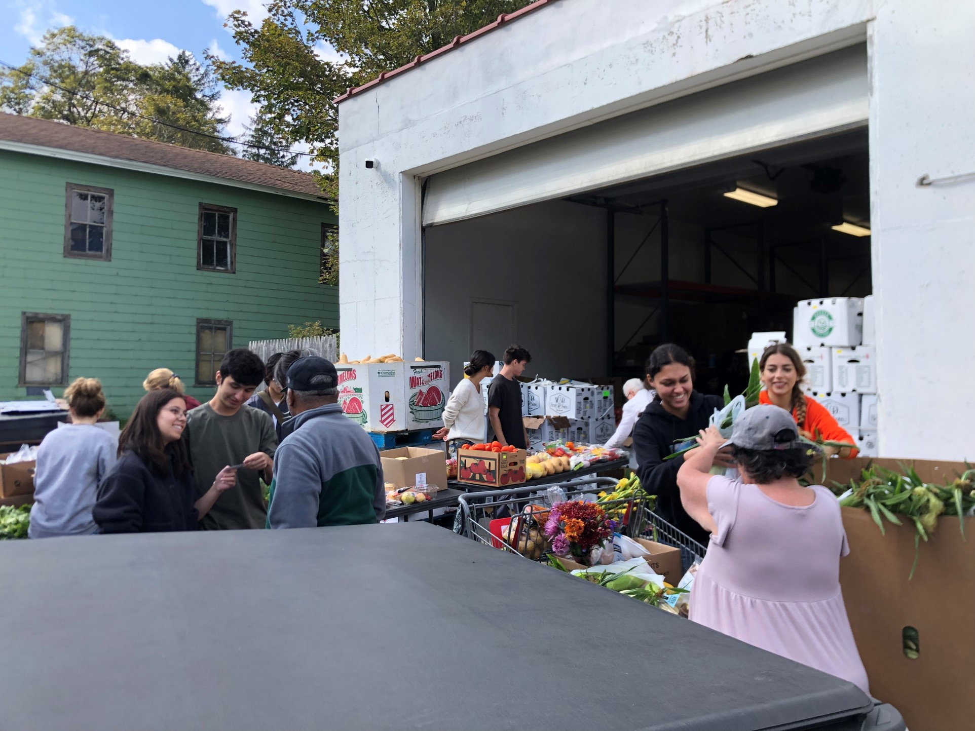 Students distribute food and supplies at the Enfield Food Distribution Center in Enfield, NY. Faculty Fellows from the College of Architecture, Art and Planning, and the Jeb E. Brooks School for Public Policy have partnered to develop designs for a new building to improve the community experience and enhance student learning. 