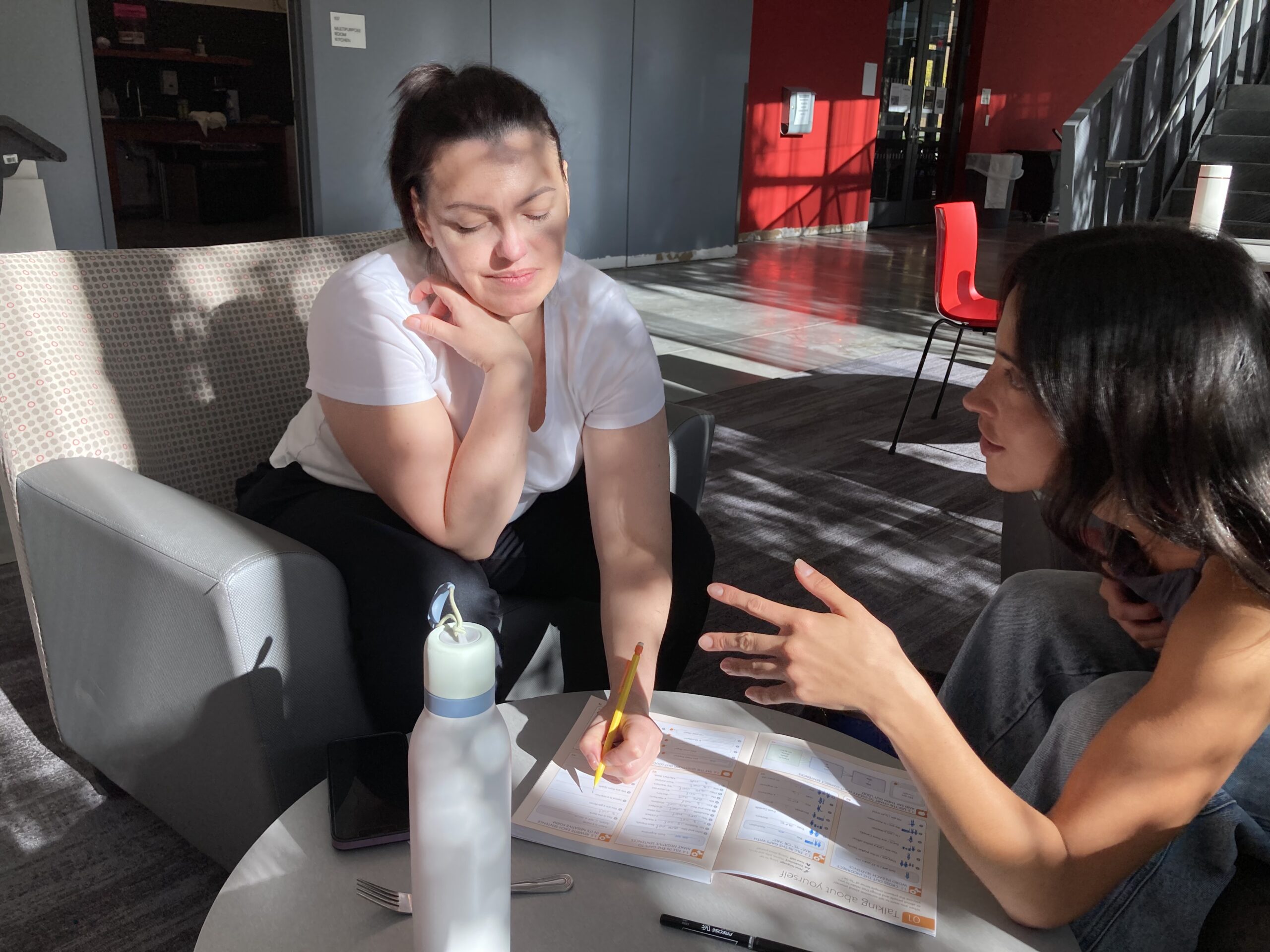 CLASP Participants Chloe Kritas'17 and Oksana Sikora review materials during one-on-one session. 